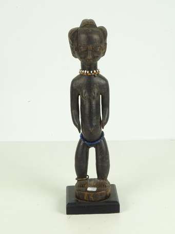 Ancienne statuette votive en bois dur noirci, 