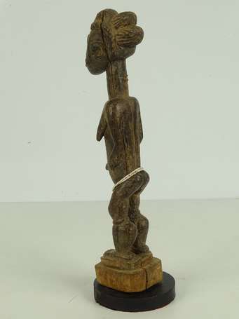 Ancienne statuette votive en bois dur à patine 