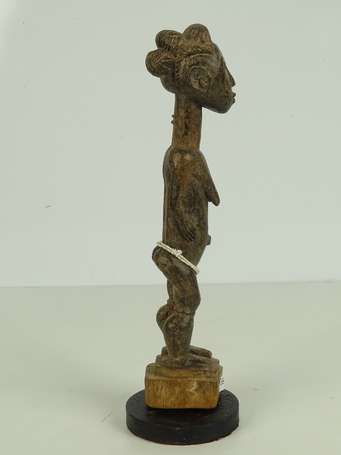 Ancienne statuette votive en bois dur à patine 
