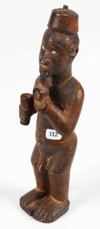 Une statuette magique 'Colon fumant la pipe' en 