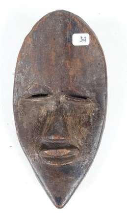 Ancien masque de coureur en bois dur avec les yeux