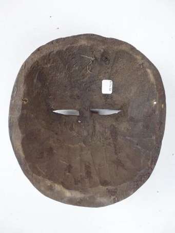 Un masque lunaire en bois. Hauteur 24 cm. Guinée