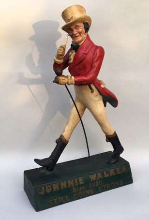 JOHNNY WALKER : Dandy en latex, socle vert. H. 