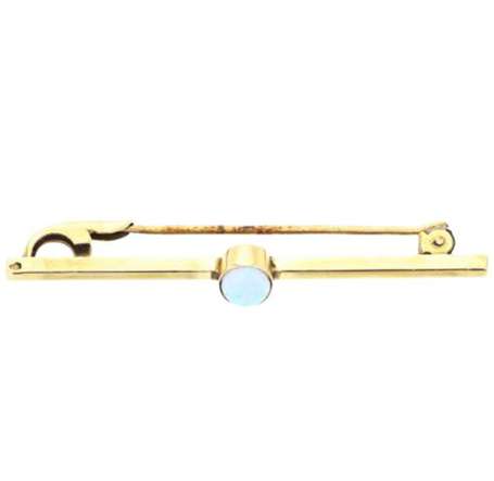 Broche ligne en or jaune 18K (750°/00) sertie d'un