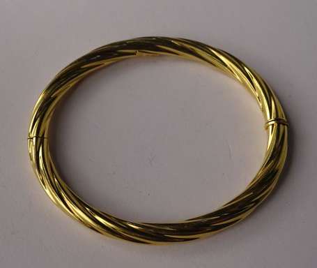 Bracelet jonc torsadé en or jaune 18K (750°/00). 