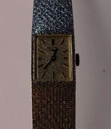 LONGINES. Montre bracelet de dame en or gris strié