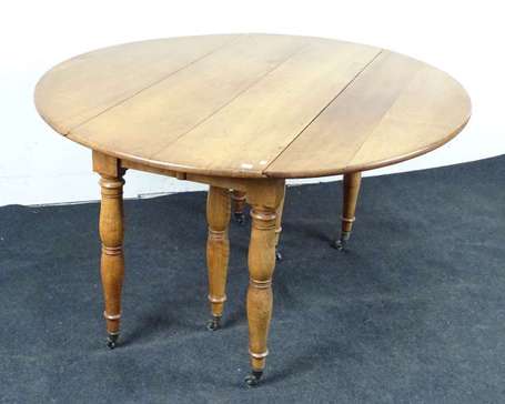 Table à volets en bois fruitier, elle repose par 