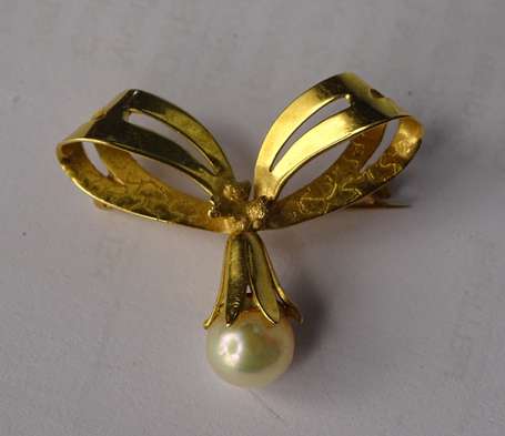 Broche nœud en or jaune 18K (750°/00) montée d'une