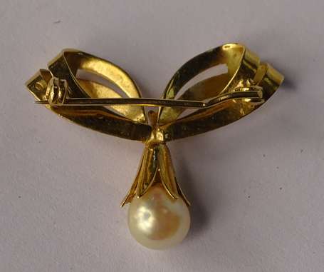 Broche nœud en or jaune 18K (750°/00) montée d'une