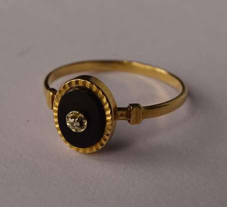 Bague en or jaune 18K (750°/00) ornée d'onyx et 