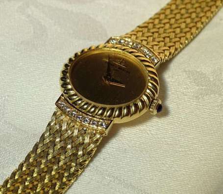 BAUME ET MERCIER - Montre bracelet de dame en or 
