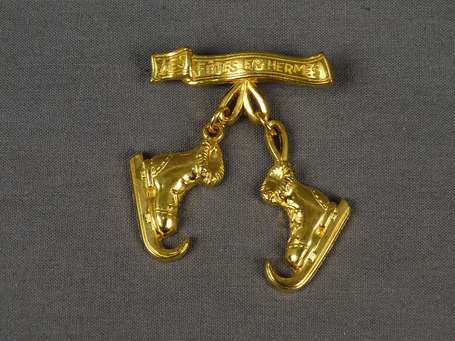 HERMES - Broche en métal doré Les fêtes en Hermès 