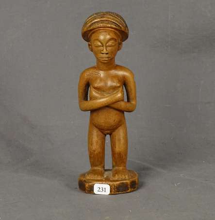 Ancienne statuette votive en bois dur à patine 