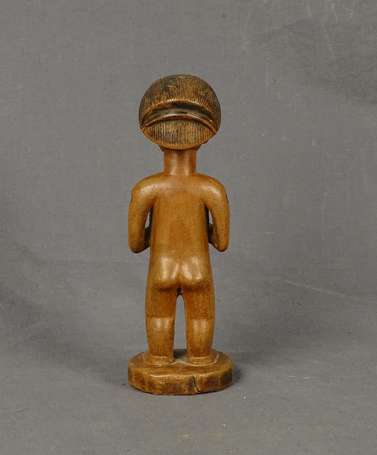 Ancienne statuette votive en bois dur à patine 