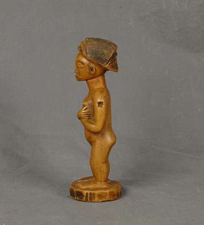 Ancienne statuette votive en bois dur à patine 