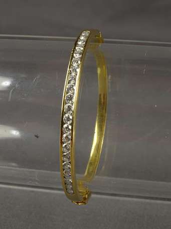 Bracelet jonc en or jaune 18k (750°/°°) serti de 