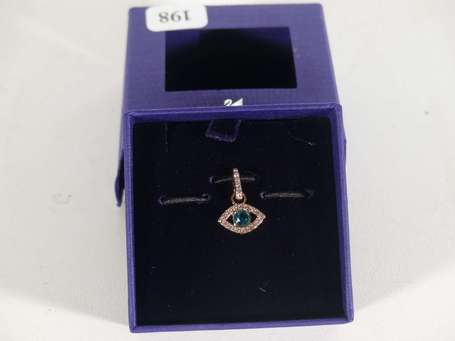 SWAROVSKI - Pendentif en métal doré figurant un 