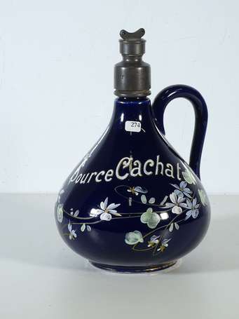 SOURCE CACHAT : Cruche en faïence à décor émaillé.