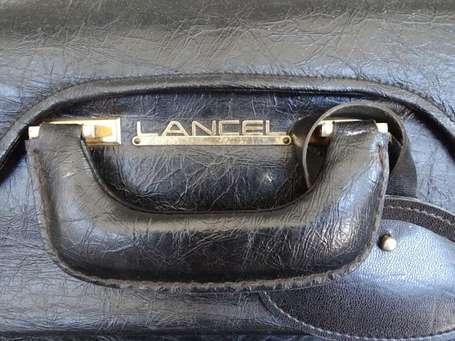 LANCEL - Deux valises en cuir noir, fermeture par 