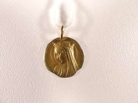 Médaille en or jaune 18K (750°/00) ornée d'un 