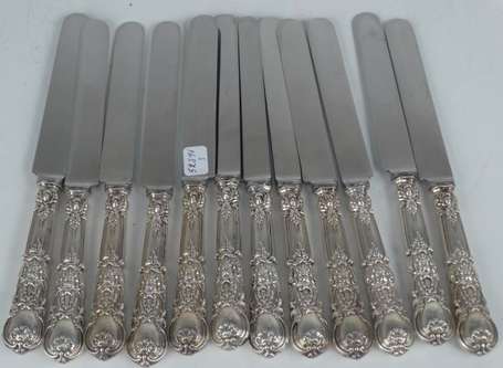 12 couteaux manches argent fourré à spatule 