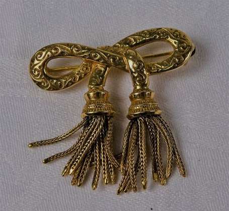 Broche nœud en or jaune 18K (750°/00) terminée par