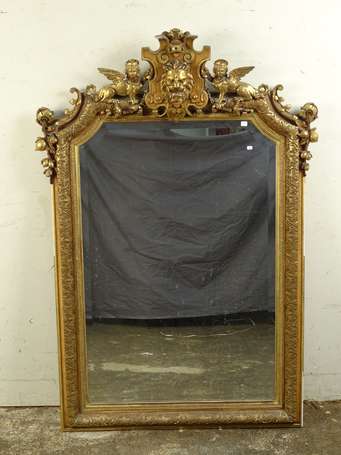 Miroir le cadre doré à frise de palmes et fleurs, 