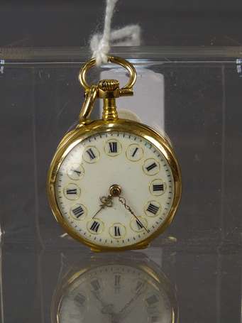 Montre pendentif En or 750°/°°° le dos à décor 