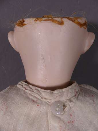 Bébé tête porcelaine marquée en creux 