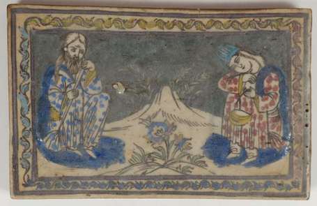 Plaque en céramique émaillée polychrome à décor de