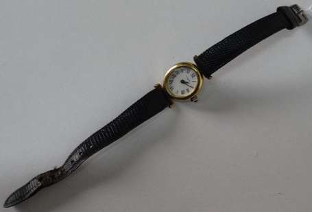 LANCEL. Montre bracelet de dame en métal doré. 