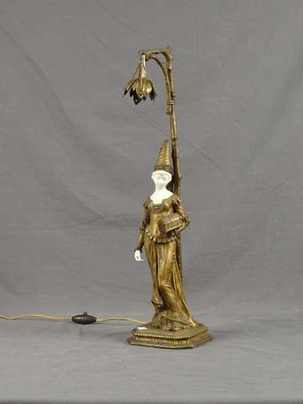 Lampe en régule patiné or à motif d'une femme à la